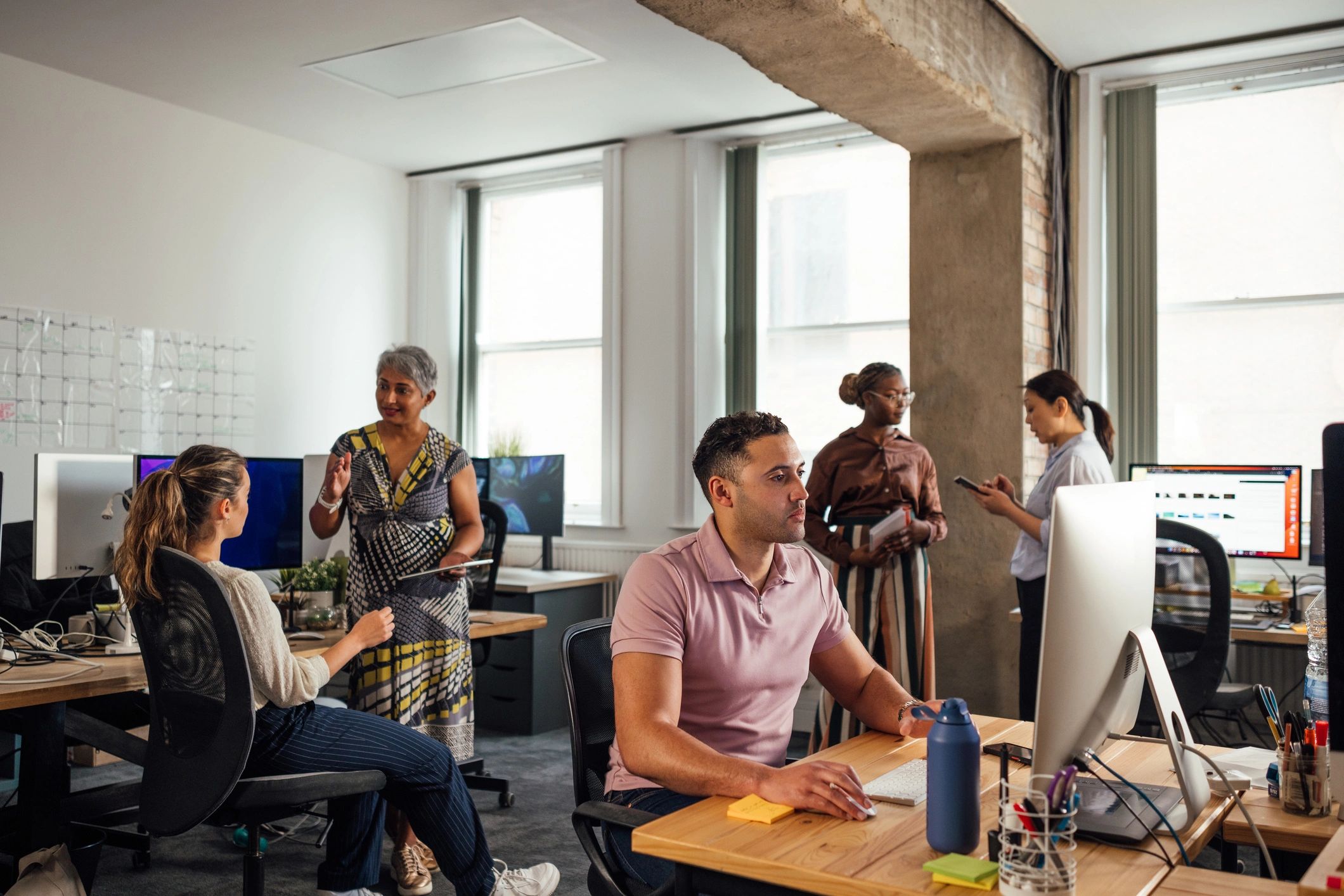 Technical team collaborating in an office environment